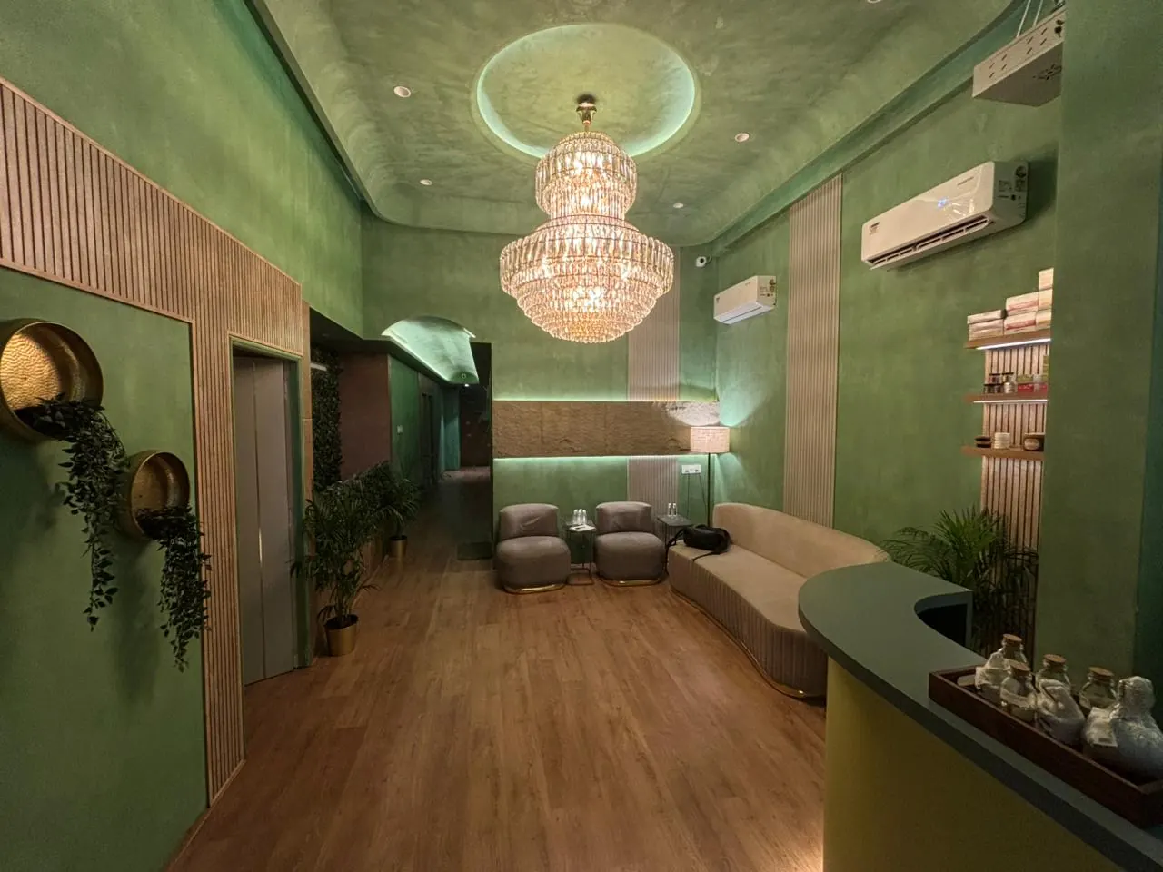 The Sector 11 reception lounge, chandelier and green lacquered ceiling
